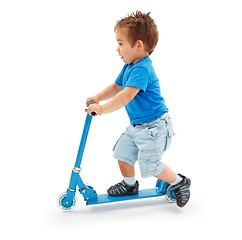 Image showing Boy playing with blue toy scooter