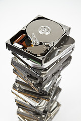 Image showing Stack of hard drive with opened one on top