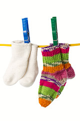 Image showing four socks on a clothesline