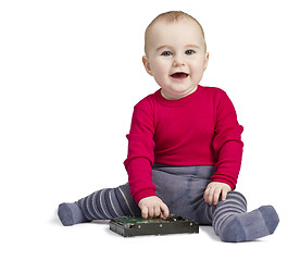 Image showing young child in white background with hard drive