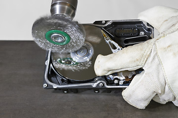 Image showing cleaning hard drive with electrical steel brush