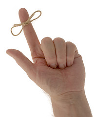 Image showing Hand with reminder string on finger