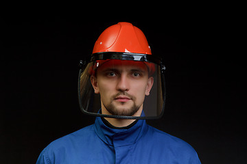 Image showing The worker in overalls