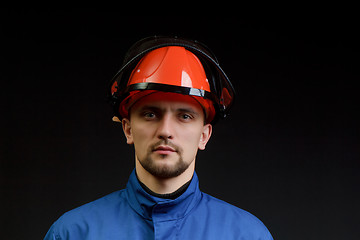 Image showing The worker in overalls