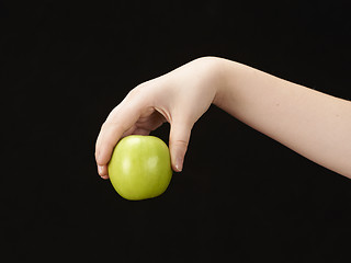 Image showing Childs hand with apple