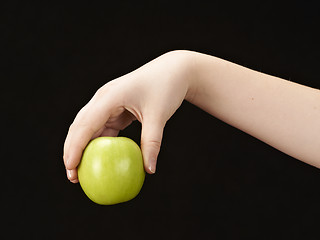 Image showing Childs hand with apple