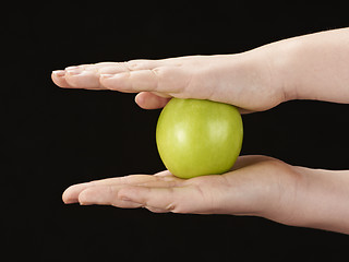 Image showing Childs hands with apple