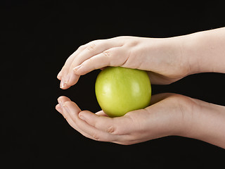 Image showing Childs hands with apple