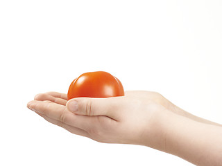 Image showing Tomatoe in the hands of child - palms facing up