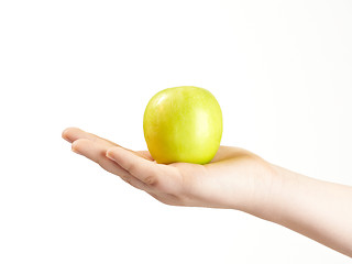 Image showing Apple in the palm og childs hand