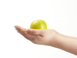 Image showing Apple in the palms og childs hands