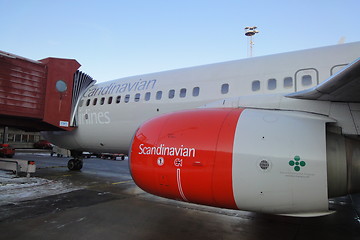 Image showing Boeing 737 from SAS connected to gate at Arlanda