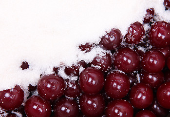 Image showing Ripe red cherries and white sugar