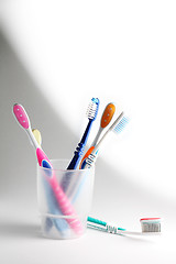 Image showing Toothbrushes in a glass