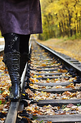 Image showing Women walking on rails