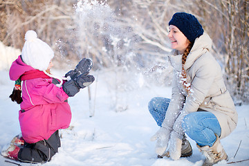 Image showing Mother and daughter outdoors at winter