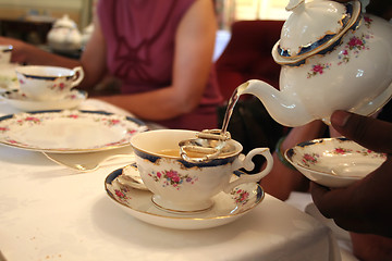 Image showing Pouring tea