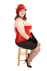 Image showing Girl sitting in corset.