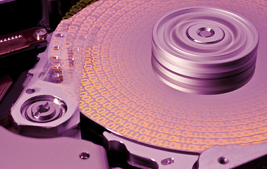 Image showing hard disk in motion with binary data  -aab-