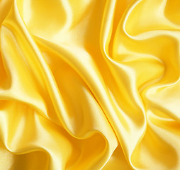 Image showing Smooth elegant golden silk as background 