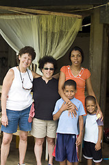 Image showing white senior tourists with native mother sons family Corn Island