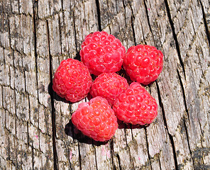 Image showing Raspberries on wood