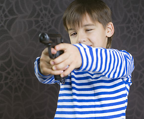 Image showing Boy with a weapon