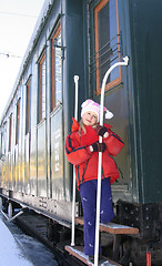 Image showing Young girl on old  locomotive