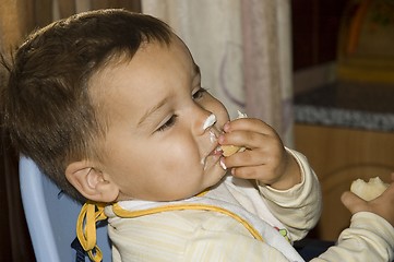 Image showing The smiling boy. Testy Ice-Cream