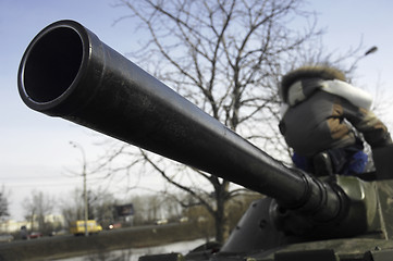 Image showing Kid on a tank