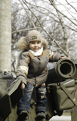 Image showing Kid on a tank