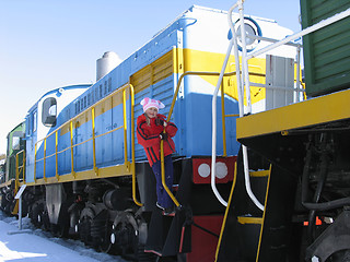 Image showing Young girl on old  locomotive