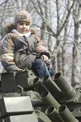 Image showing Kid on a tank