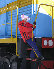 Image showing Young girl on old  locomotive