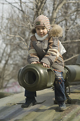 Image showing Kid on a tank