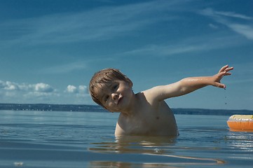 Image showing Swimming kid. Happy childhood