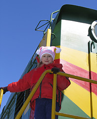 Image showing Young girl on old  locomotive