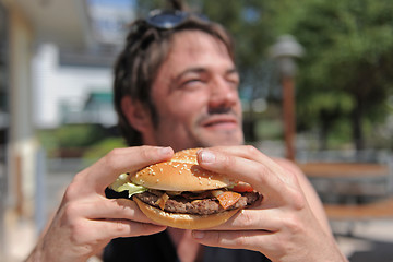 Image showing man and hamburger