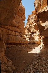 Image showing Narrow slot between two rocks in desert canyon