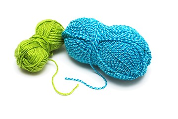 Image showing Clews of blue and green wool threads for knitting isolated