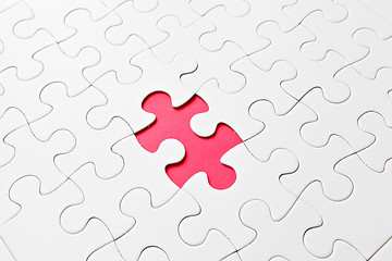 Image showing puzzle with missing parts, which are connected