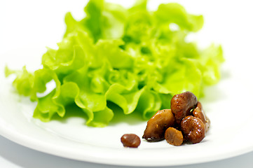 Image showing Chanterelles mushrooms with salad leaves