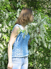 Image showing Girl and bird cherry tree