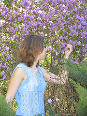 Image showing Girl and rhododendron