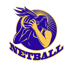 Image showing  netball player holding passing ball 