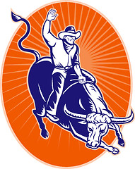 Image showing rodeo cowboy riding jumping longhorn bull