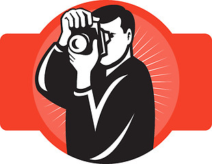 Image showing photographer aiming slr camera front