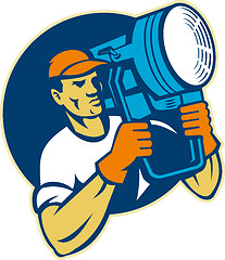 Image showing film lighting crew holding a spotlight