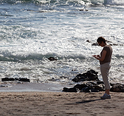 Image showing Woman beachcomb on Glass Beach