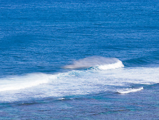 Image showing Rainbow colors in spray from waves